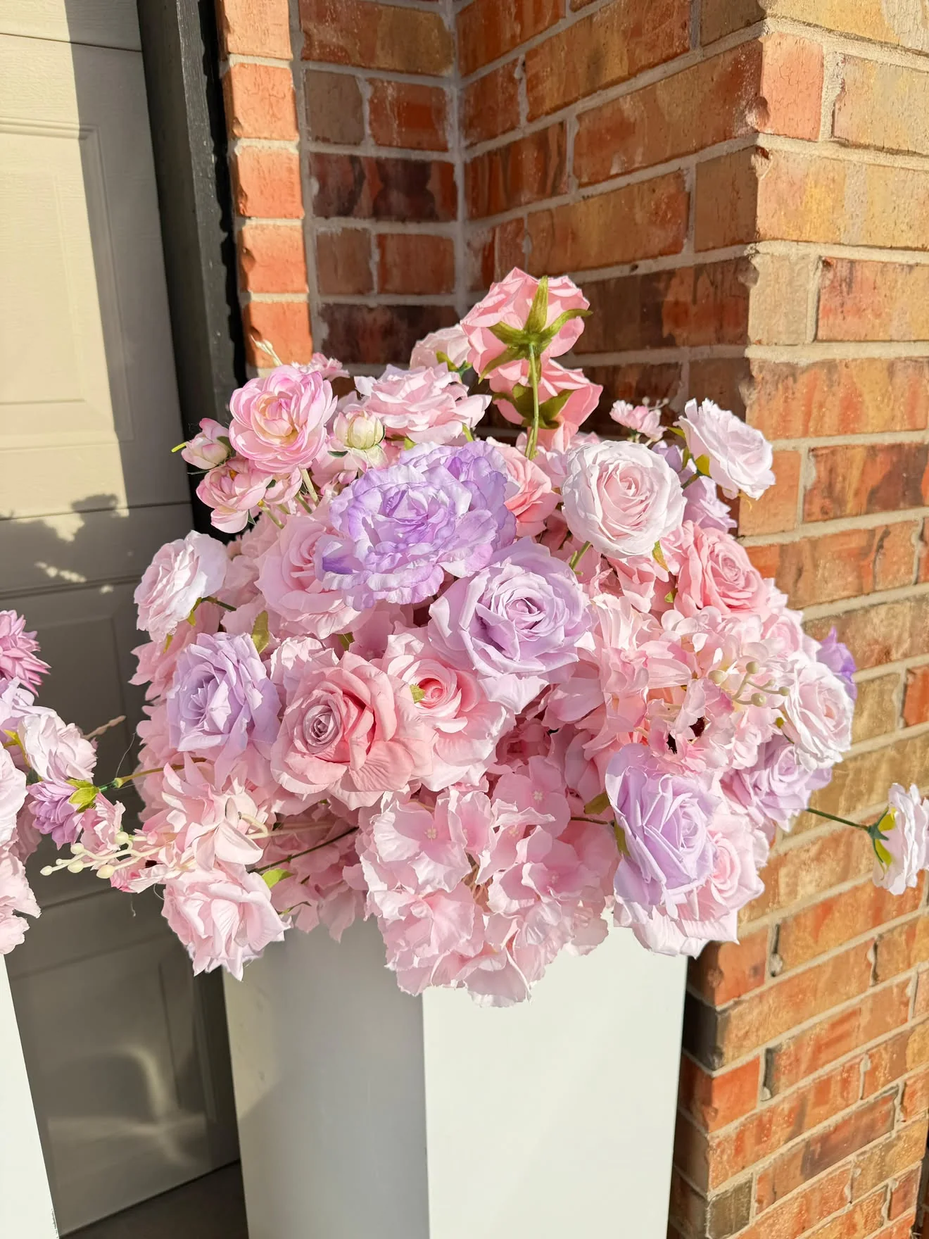 Blush garden floral backdrop arrangement on white pedestal rental OKC